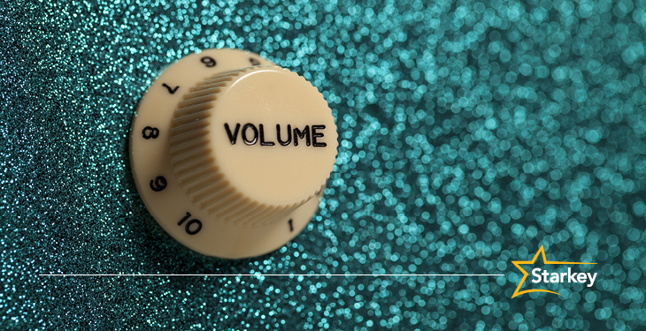 Volume dial going up to 10 on teal glitter amplifier